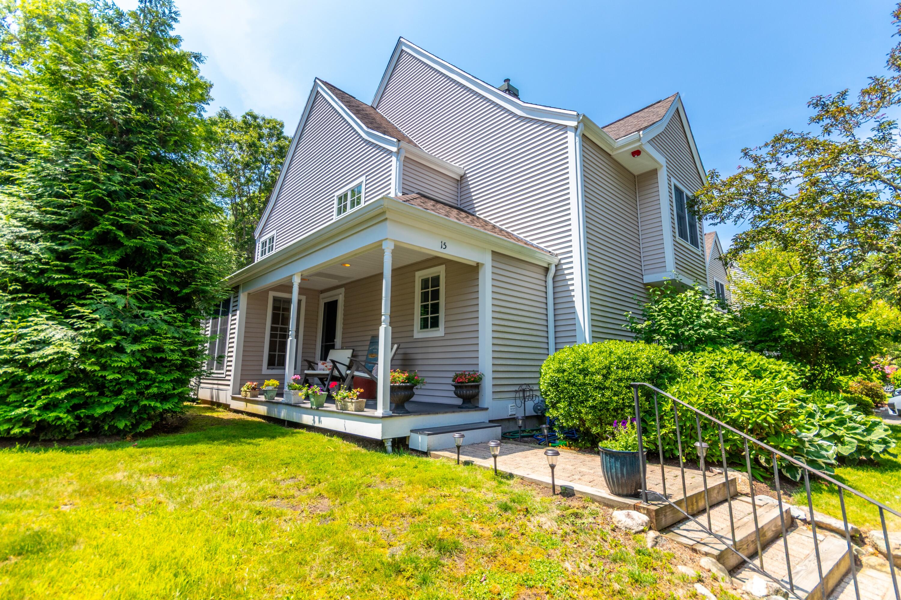 15 Hampton Court, Unit 15 Mashpee, MA 02649 - Photo 2 of 40 a view of a house with pool and sitting area