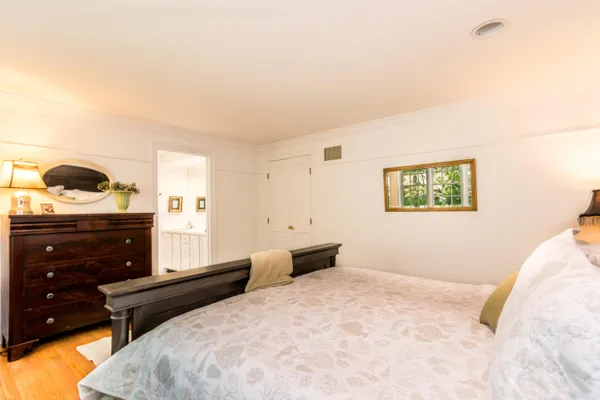 a bedroom with a bed and a couch