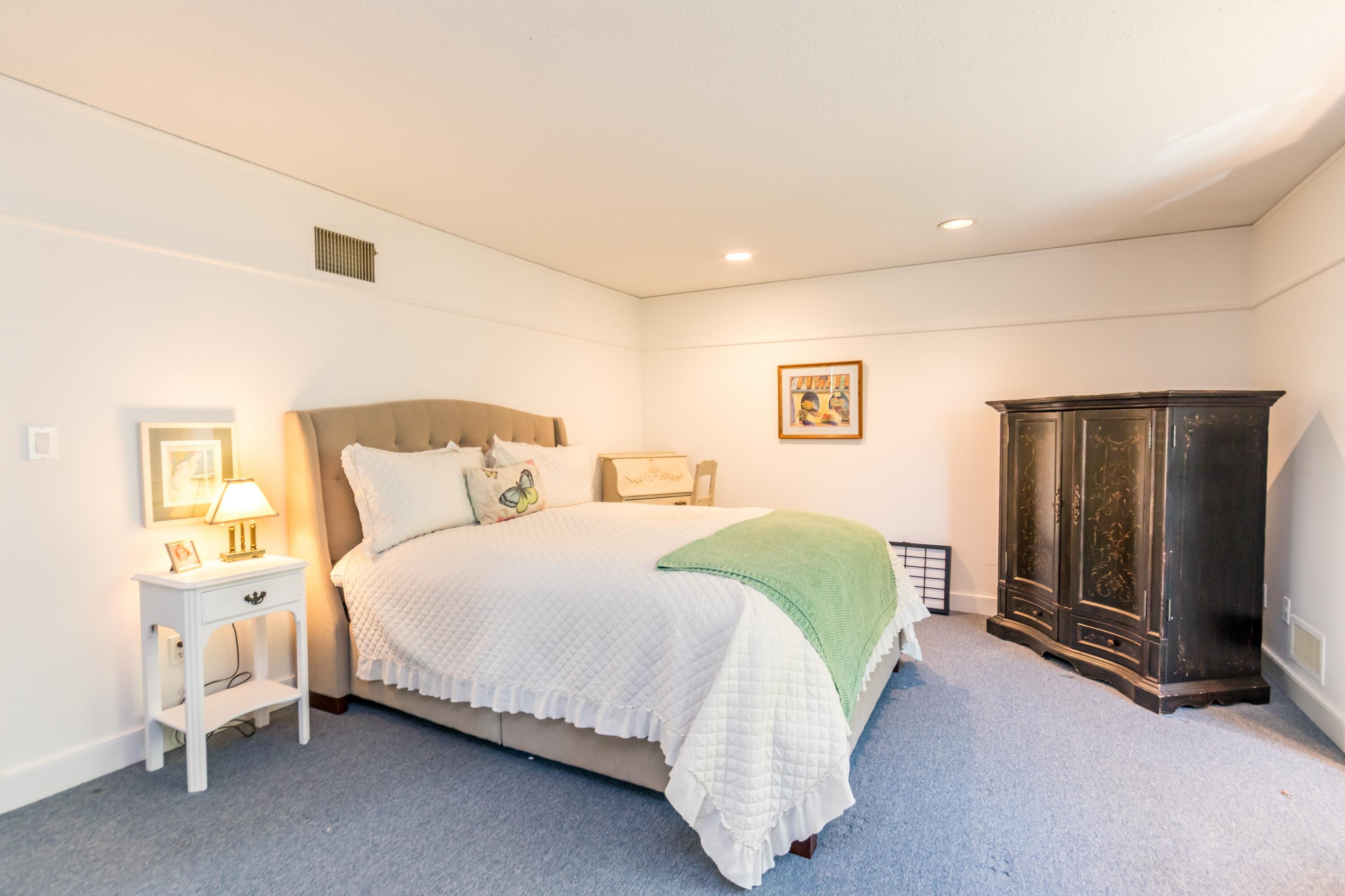 15 Hampton Court, Unit 15 Mashpee, MA 02649 - Photo 25 of 40 a bedroom with a bed and a tv