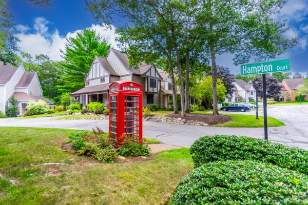 a front view of a house with a yard table and chairs