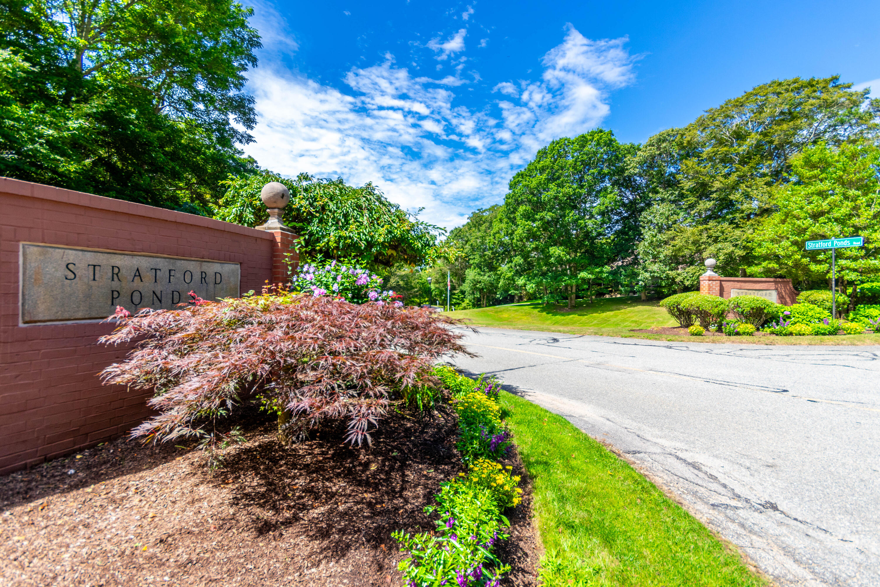15 Hampton Court, Unit 15 Mashpee, MA 02649 - Photo 39 of 40 a view of a yard with flower plants