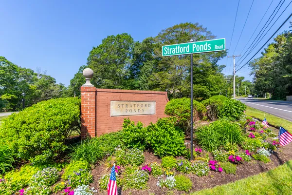 a sign that is in front of flowers