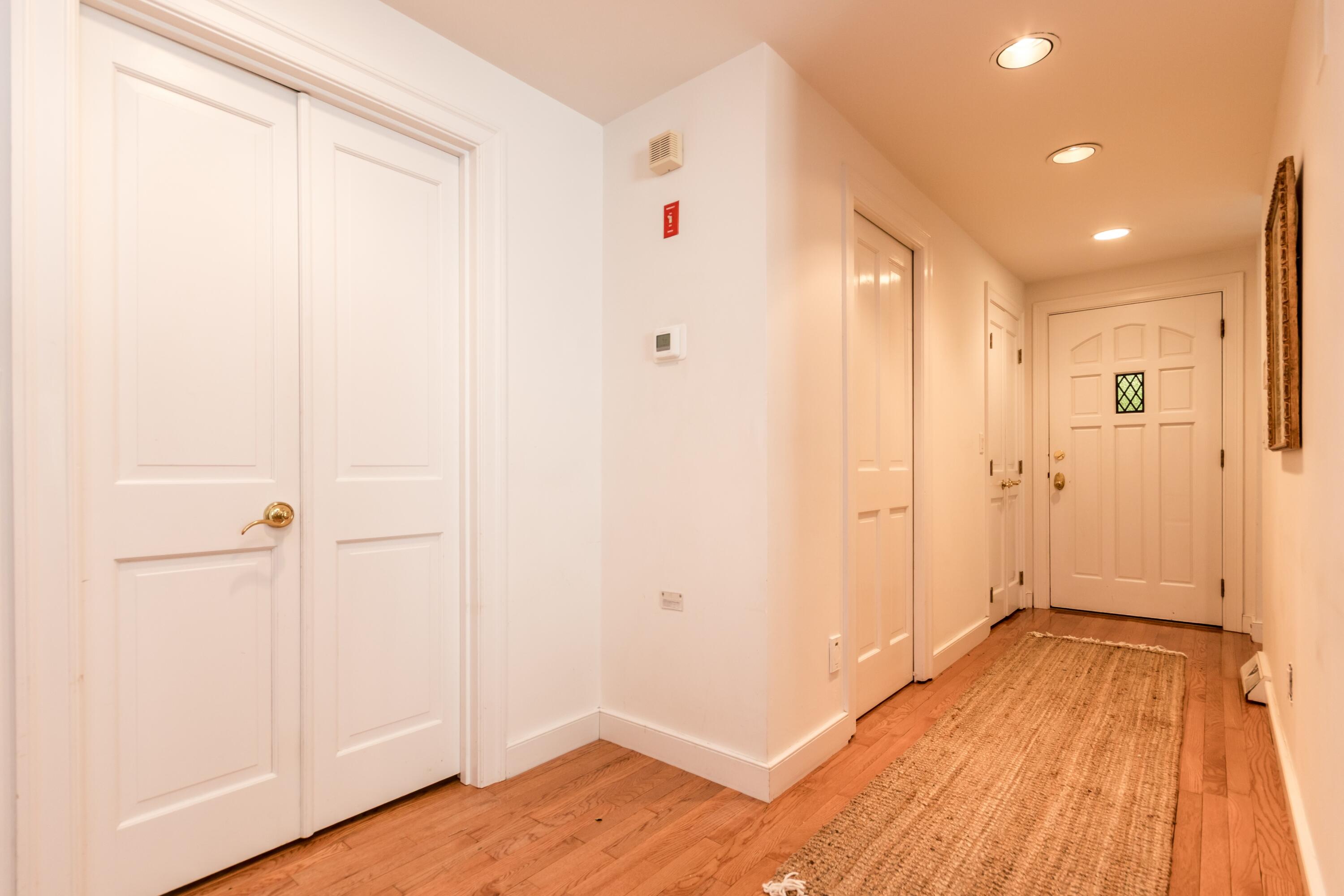 15 Hampton Court, Unit 15 Mashpee, MA 02649 - Photo 6 of 40 a view of a hallway with wooden floor