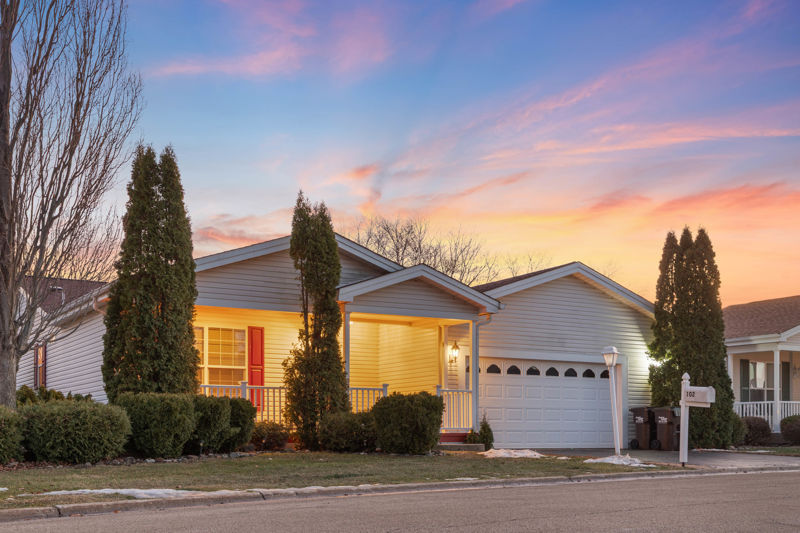 a front view of a house with a yard