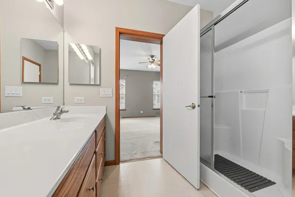 a bathroom with a sink and mirror