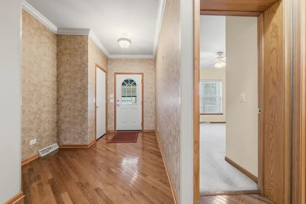 a view of a bathroom with wooden floor