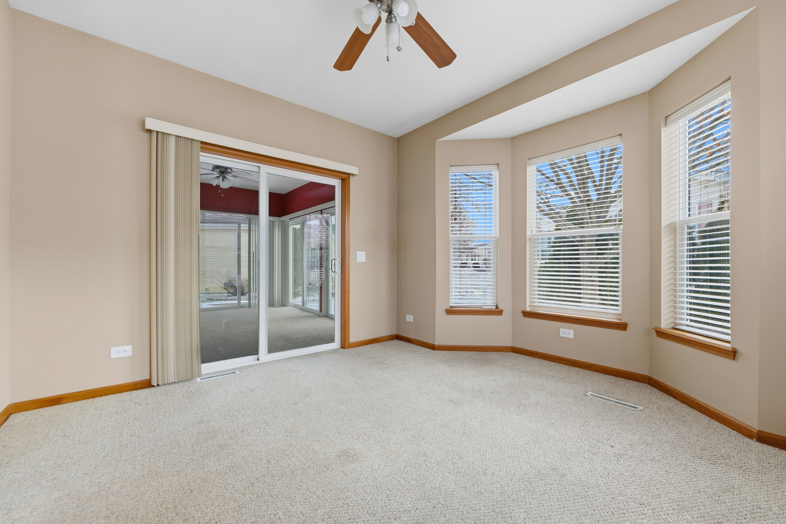 102 Hitching Post Lane Grayslake, IL 60030 - Photo 21 of 58 a view of an empty room with a window and outer view