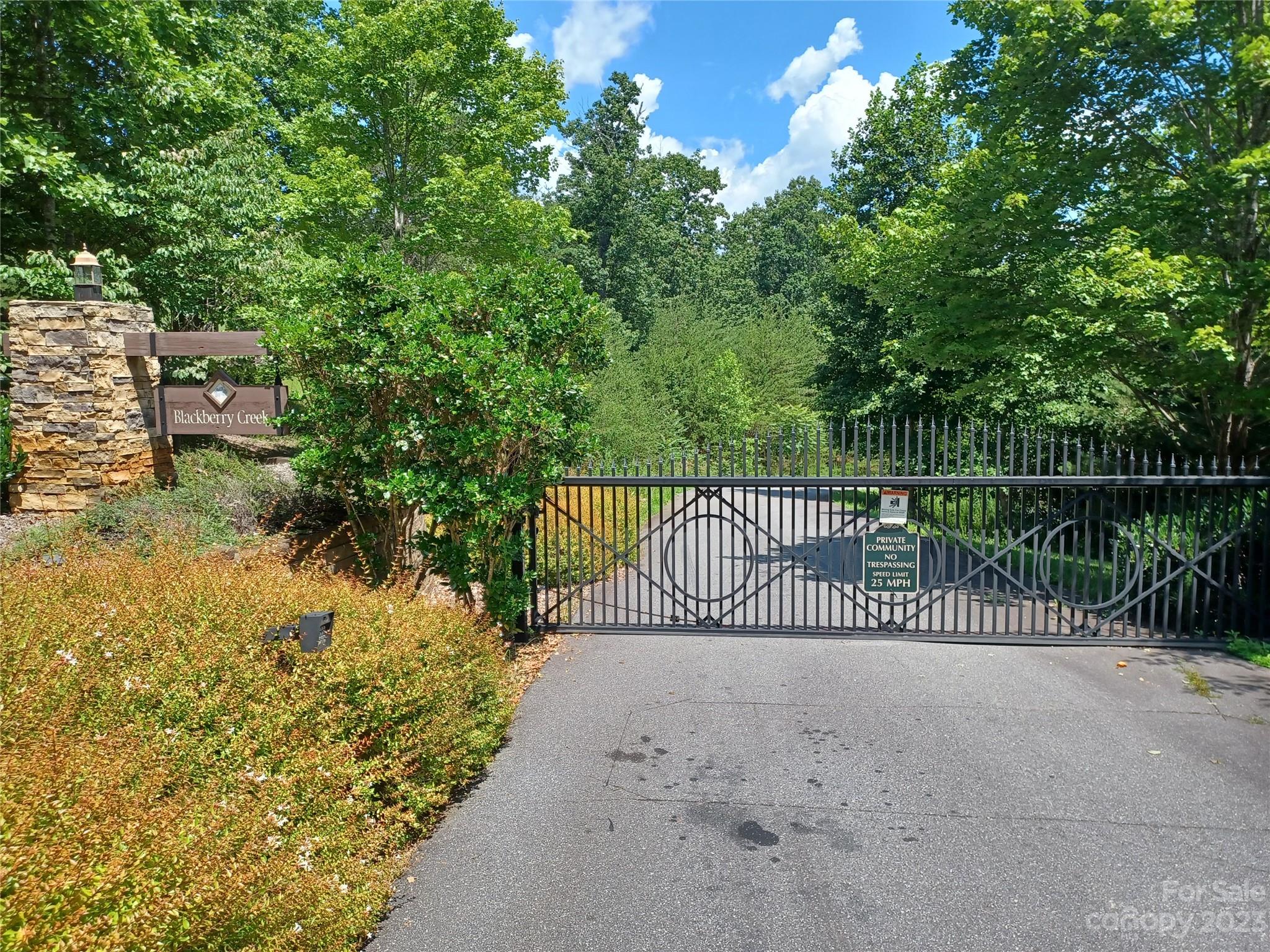 a view of a gate and fence