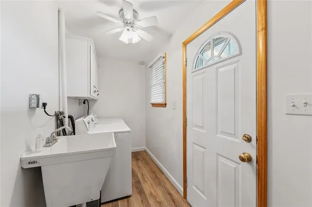 a bathroom with a sink a mirror and a window