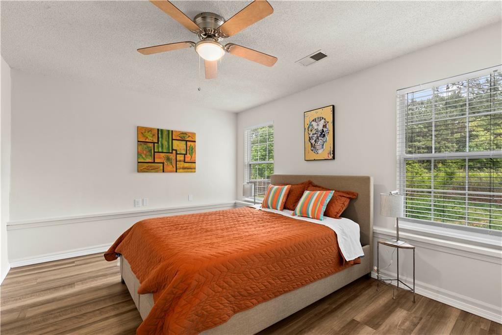 1700 English Ivey Lane Kennesaw, GA 30144 - Photo 15 of 29 a bedroom with a large bed and a window