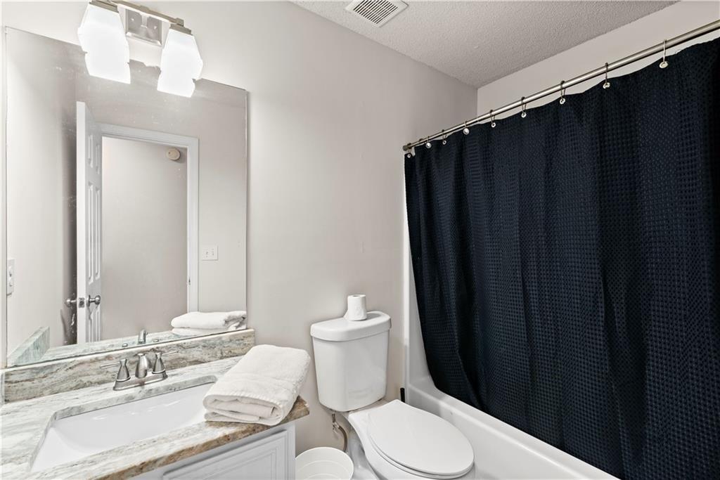 1700 English Ivey Lane Kennesaw, GA 30144 - Photo 18 of 29 a bathroom with a sink and a toilet