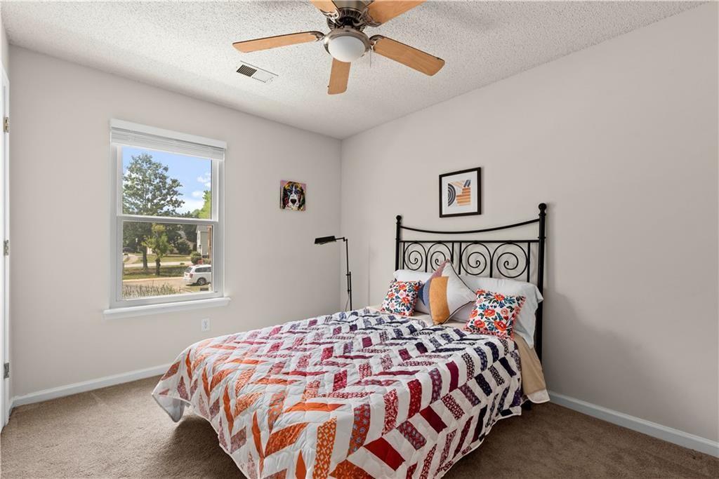 1700 English Ivey Lane Kennesaw, GA 30144 - Photo 20 of 29 a bedroom with a bed and window