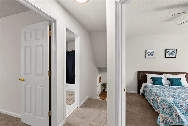 a bedroom with a bed and a chair