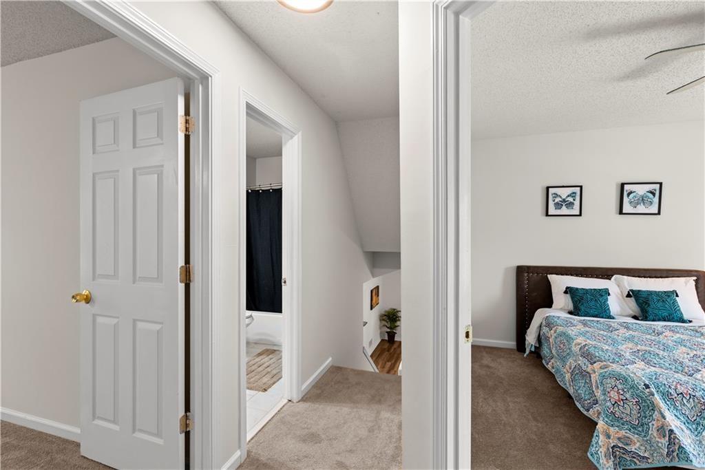 1700 English Ivey Lane Kennesaw, GA 30144 - Photo 26 of 29 a bedroom with a bed and a chair