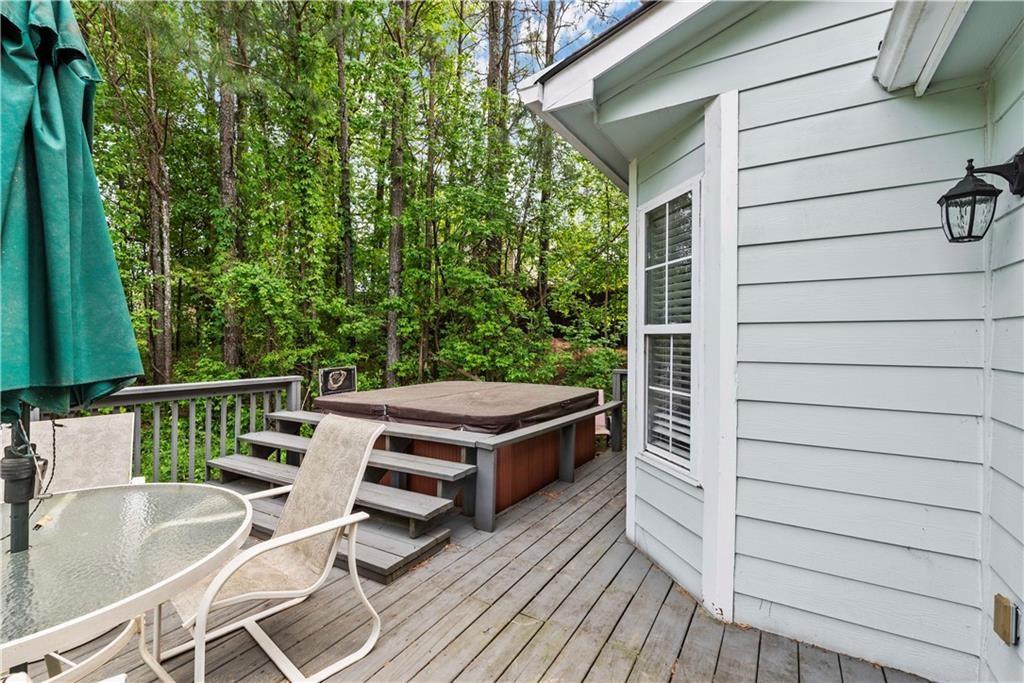 1700 English Ivey Lane Kennesaw, GA 30144 - Photo 28 of 29 a balcony with a table and chairs