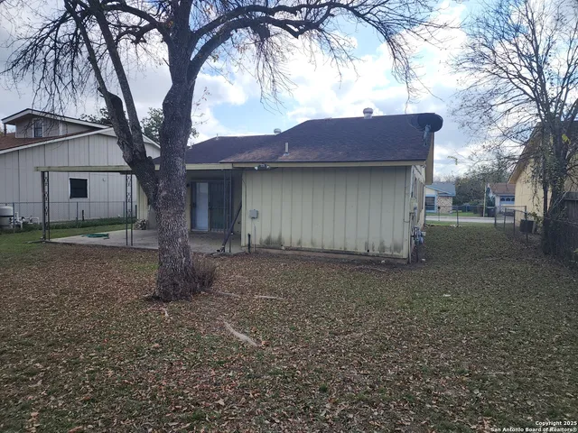 a house view with a backyard space