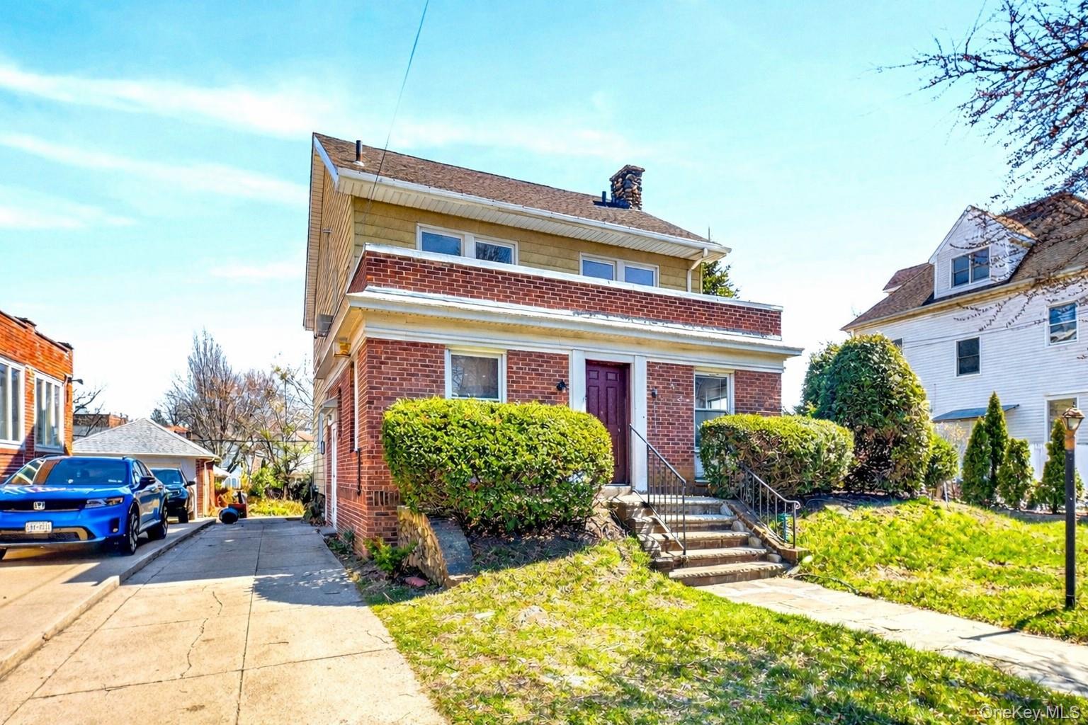 35-71 162nd Street Queens, NY 11358 - Photo 2 of 11 a front view of multiple houses with yard