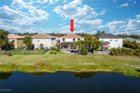 an aerial view of a house with a swimming pool