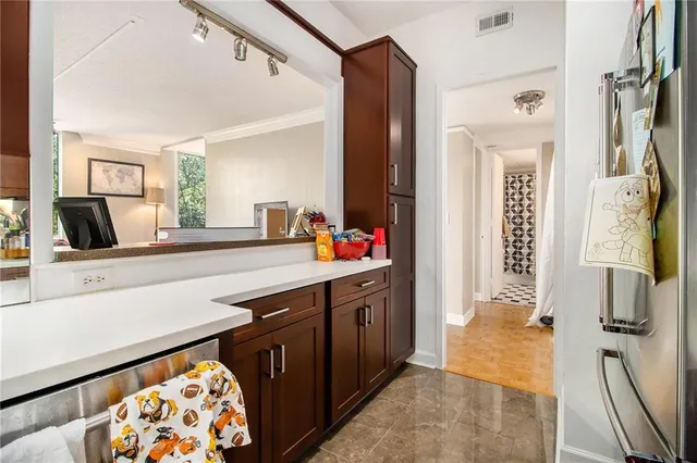 a spacious bathroom with a sink double vanity and a mirror