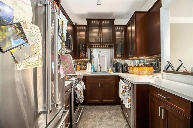 a view of a kitchen with a sink and cabinets