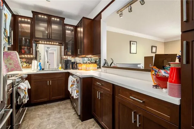 a utility room with sink dryer and washer
