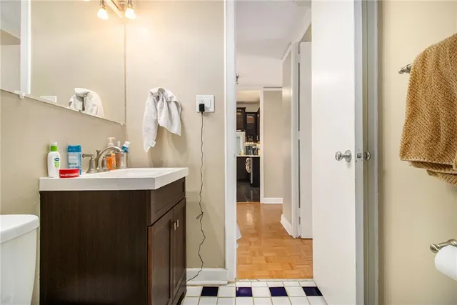 a bathroom with a sink and mirror