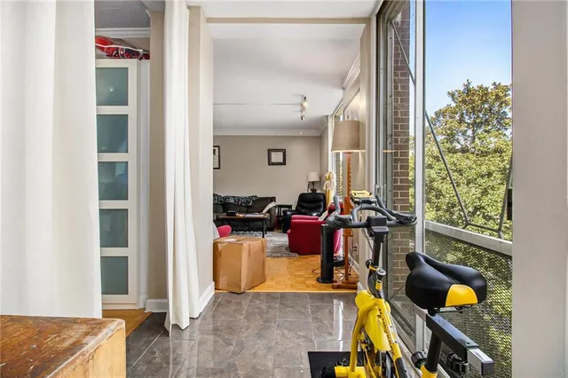 a view of a livingroom with furniture and windows