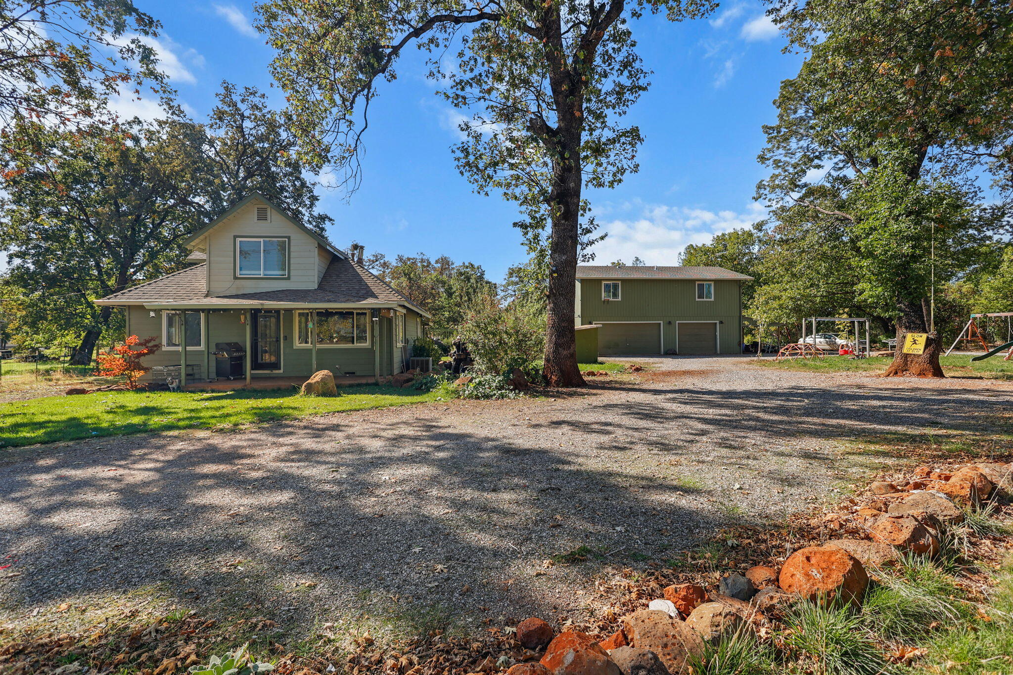 a front view of a house with swimming pool having outdoor seating