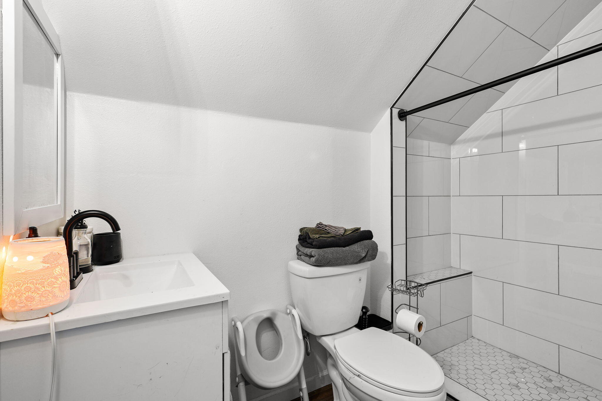 28093 Highway 44 Shingletown, CA 96088 - Photo 12 of 42 a white toilet sitting next to a bathroom sink