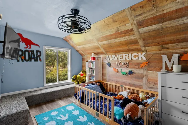 a room with lots of furniture and white walls