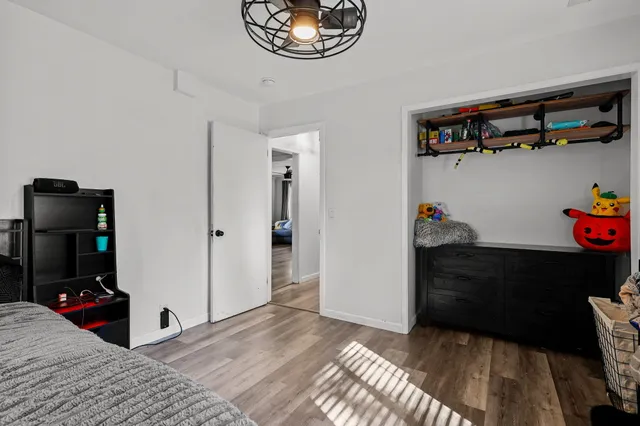 a bedroom with a bed and a closet