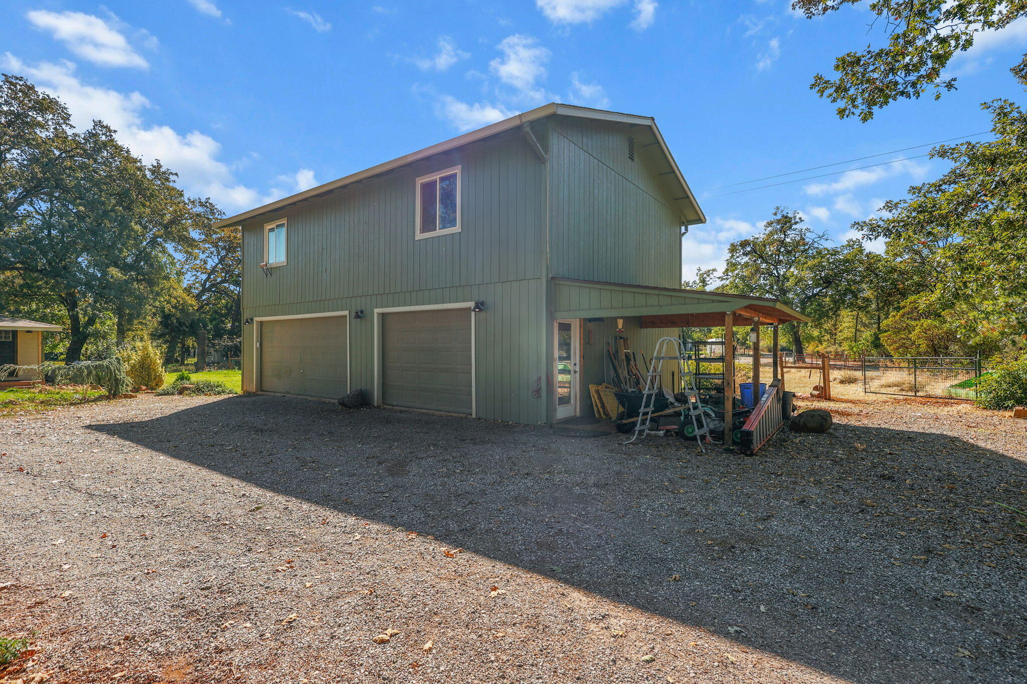 28093 Highway 44 Shingletown, CA 96088 - Photo 22 of 42 a view of a house with a yard and garage