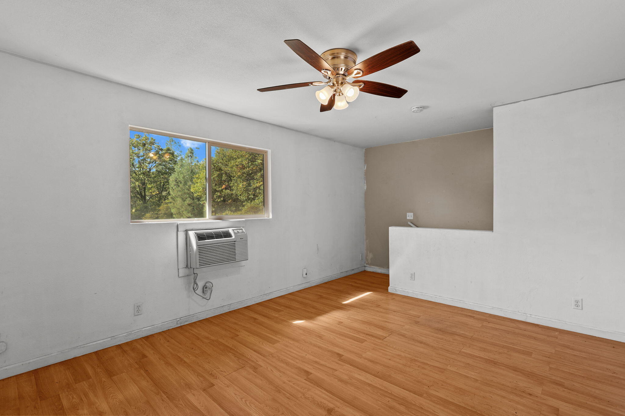 28093 Highway 44 Shingletown, CA 96088 - Photo 25 of 42 a view of empty room with wooden floor