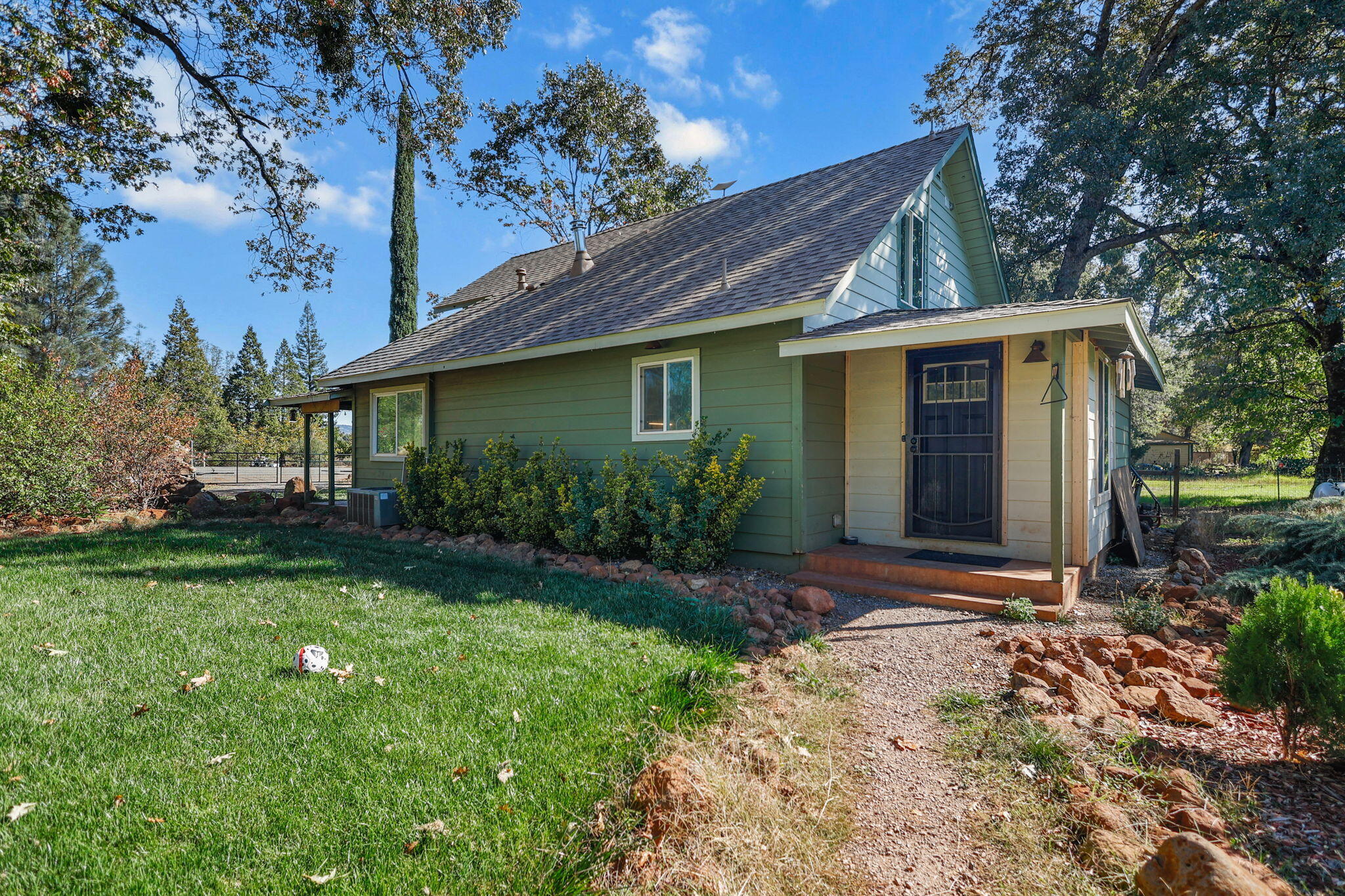 28093 Highway 44 Shingletown, CA 96088 - Photo 34 of 42 a front view of a house with garden
