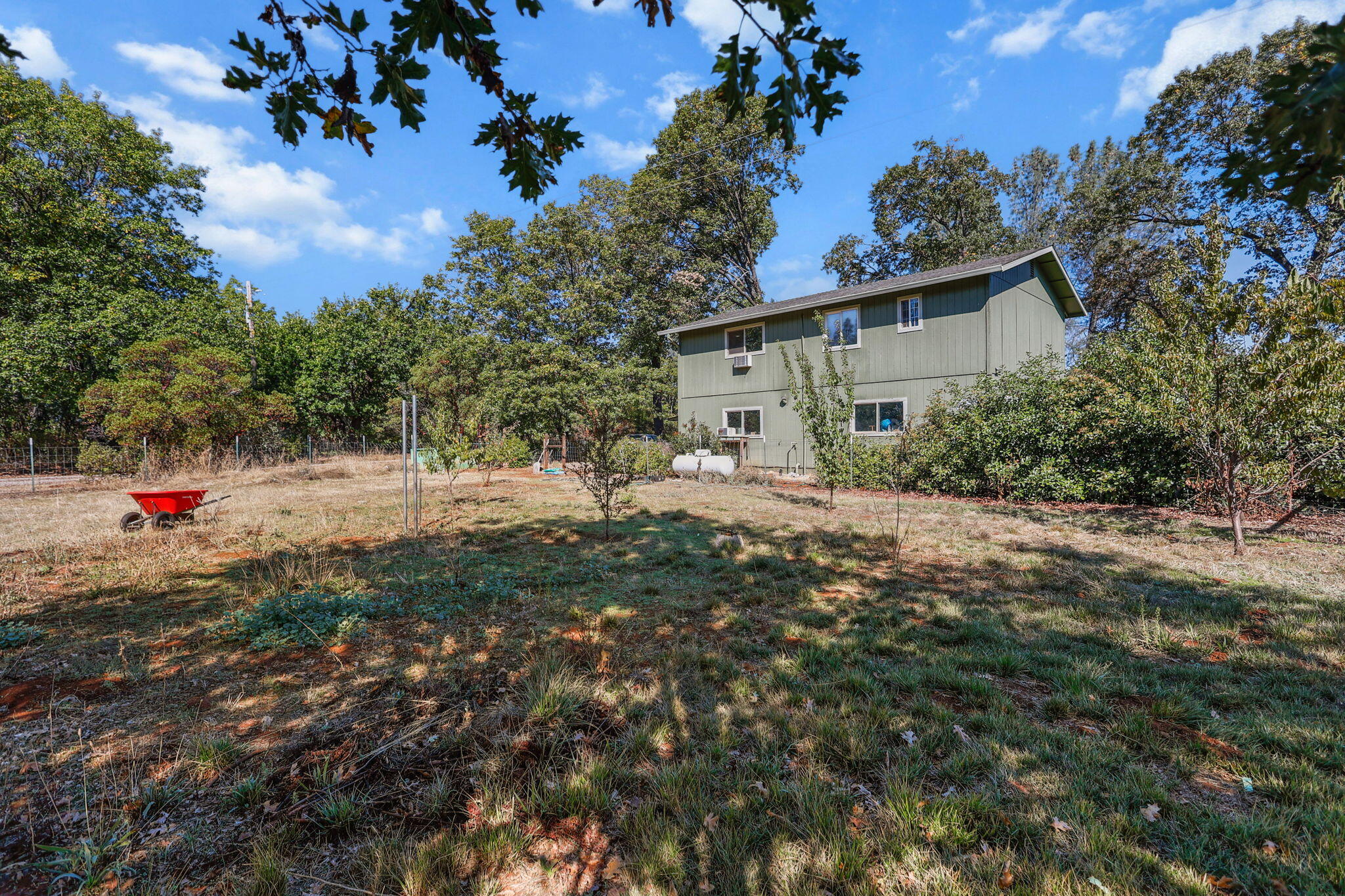28093 Highway 44 Shingletown, CA 96088 - Photo 35 of 42 a backyard of a house with table and chairs