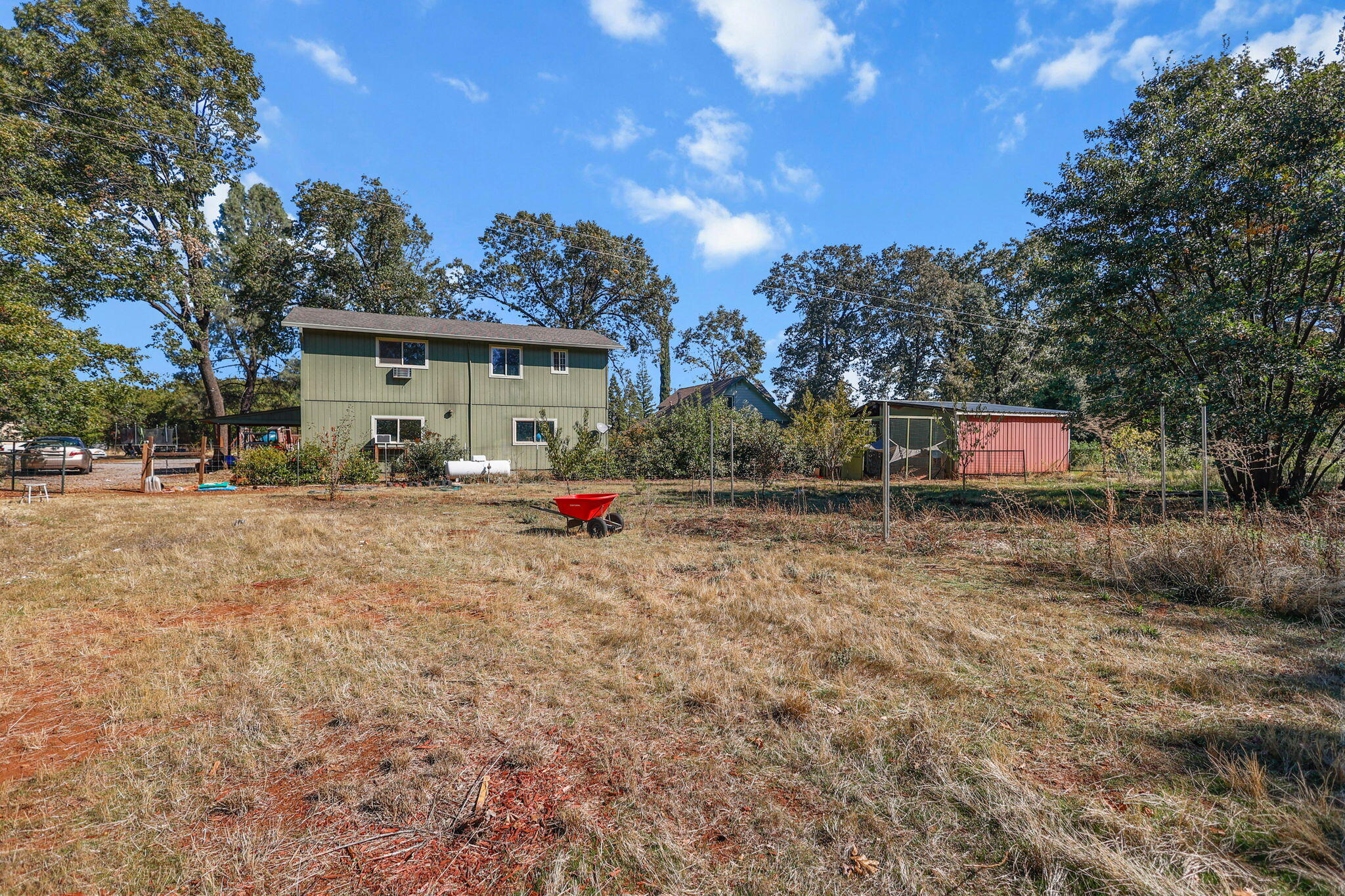 28093 Highway 44 Shingletown, CA 96088 - Photo 36 of 42 a backyard of a house with table and chairs