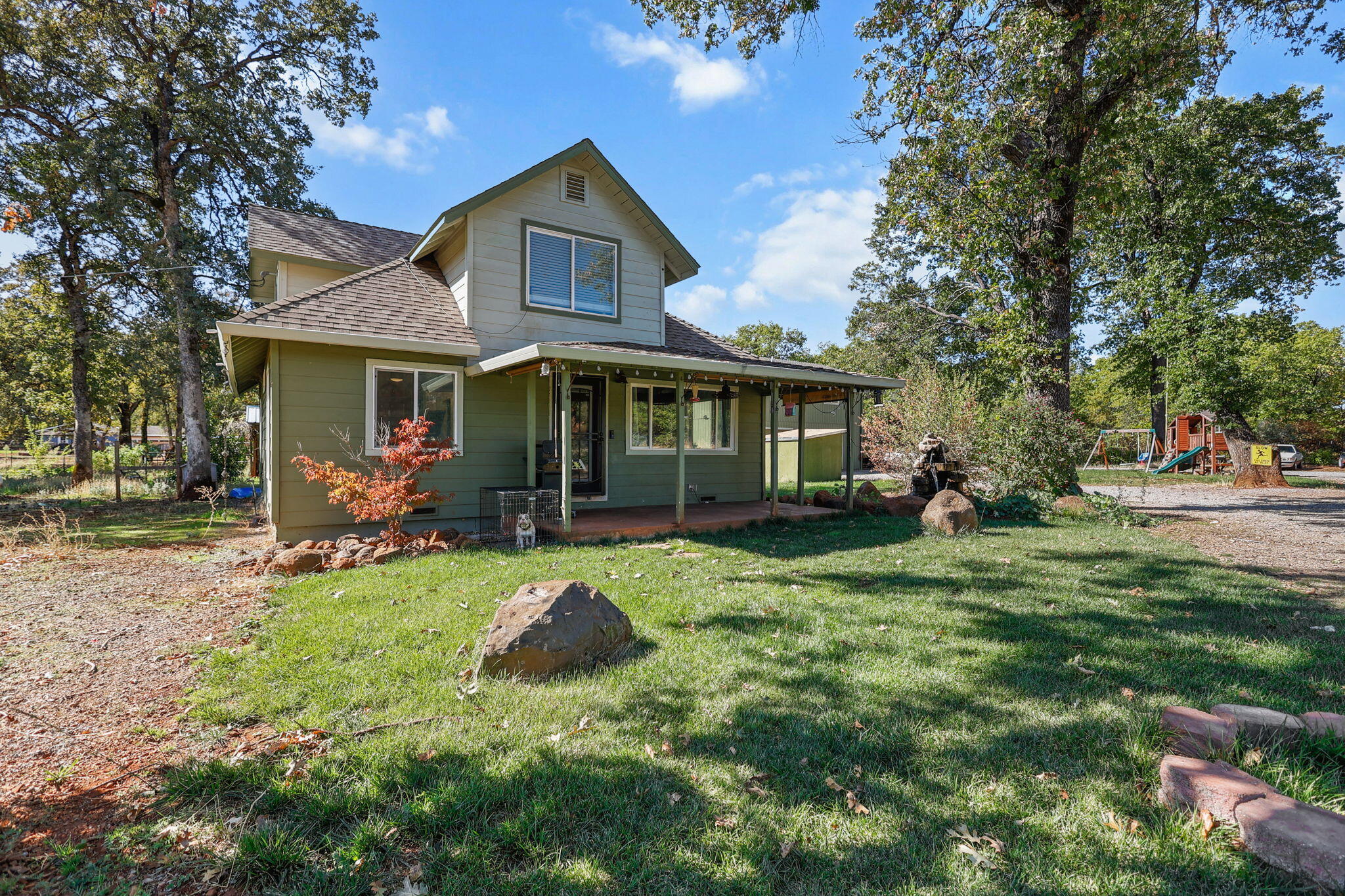 28093 Highway 44 Shingletown, CA 96088 - Photo 38 of 42 a view of a house with a yard porch and sitting area