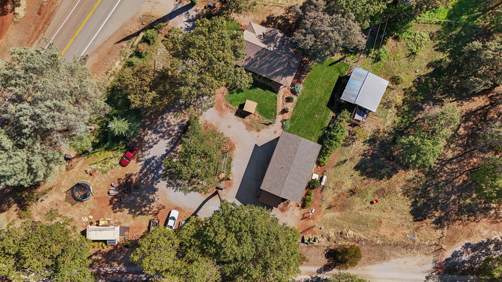 28093 Highway 44 Shingletown, CA 96088 - Photo 41 of 42 an aerial view of a house with a yard and trees