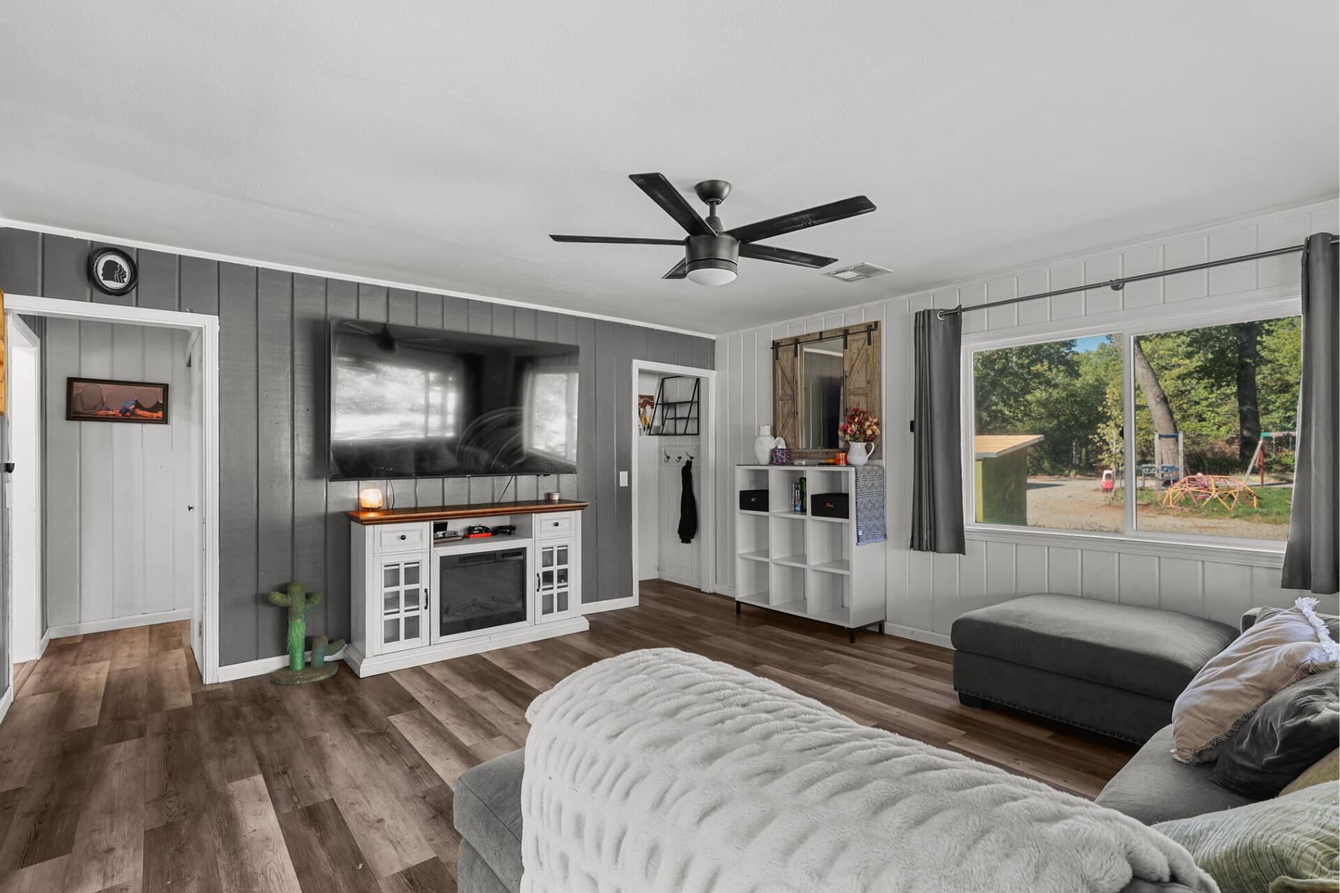 28093 Highway 44 Shingletown, CA 96088 - Photo 5 of 42 a bedroom with furniture and a flat screen tv