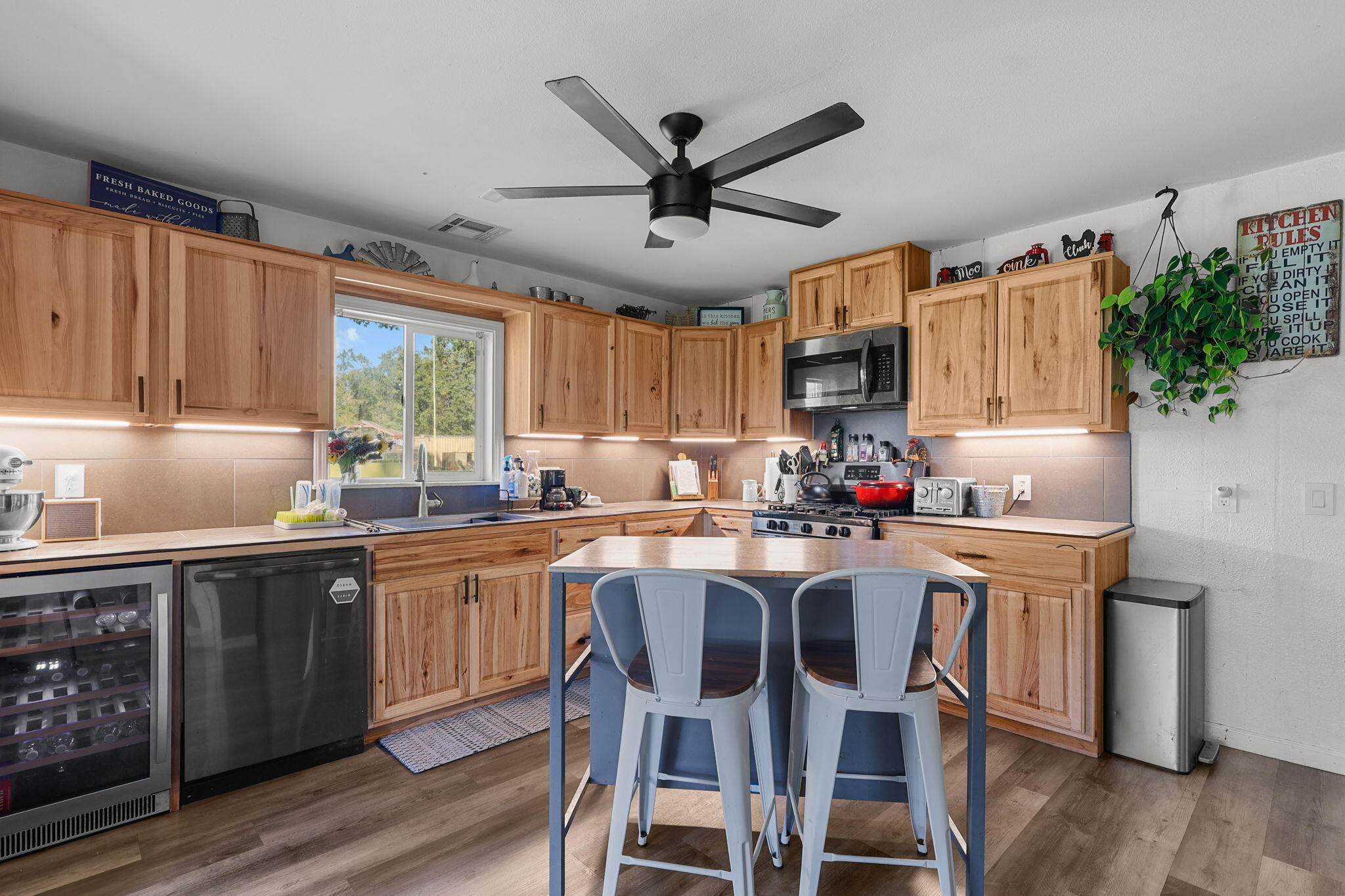 28093 Highway 44 Shingletown, CA 96088 - Photo 6 of 42 a kitchen with granite countertop cabinets stainless steel appliances dining table and chairs