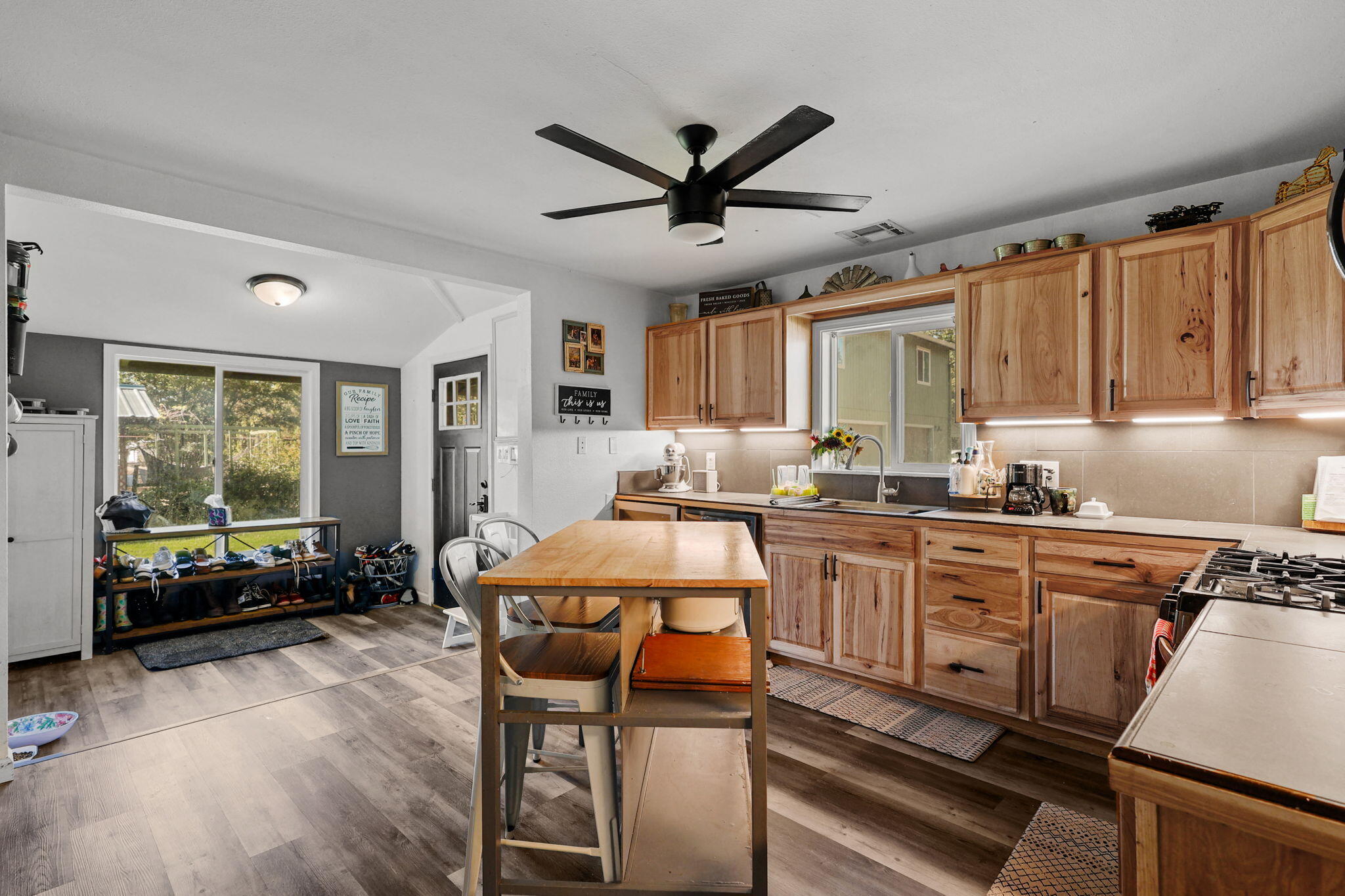 28093 Highway 44 Shingletown, CA 96088 - Photo 7 of 42 a kitchen with a table chairs stove and cabinets