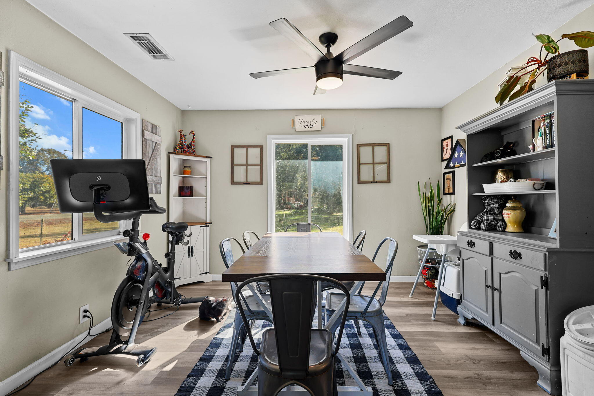 28093 Highway 44 Shingletown, CA 96088 - Photo 8 of 42 a view of a dining room with furniture window and wooden floor