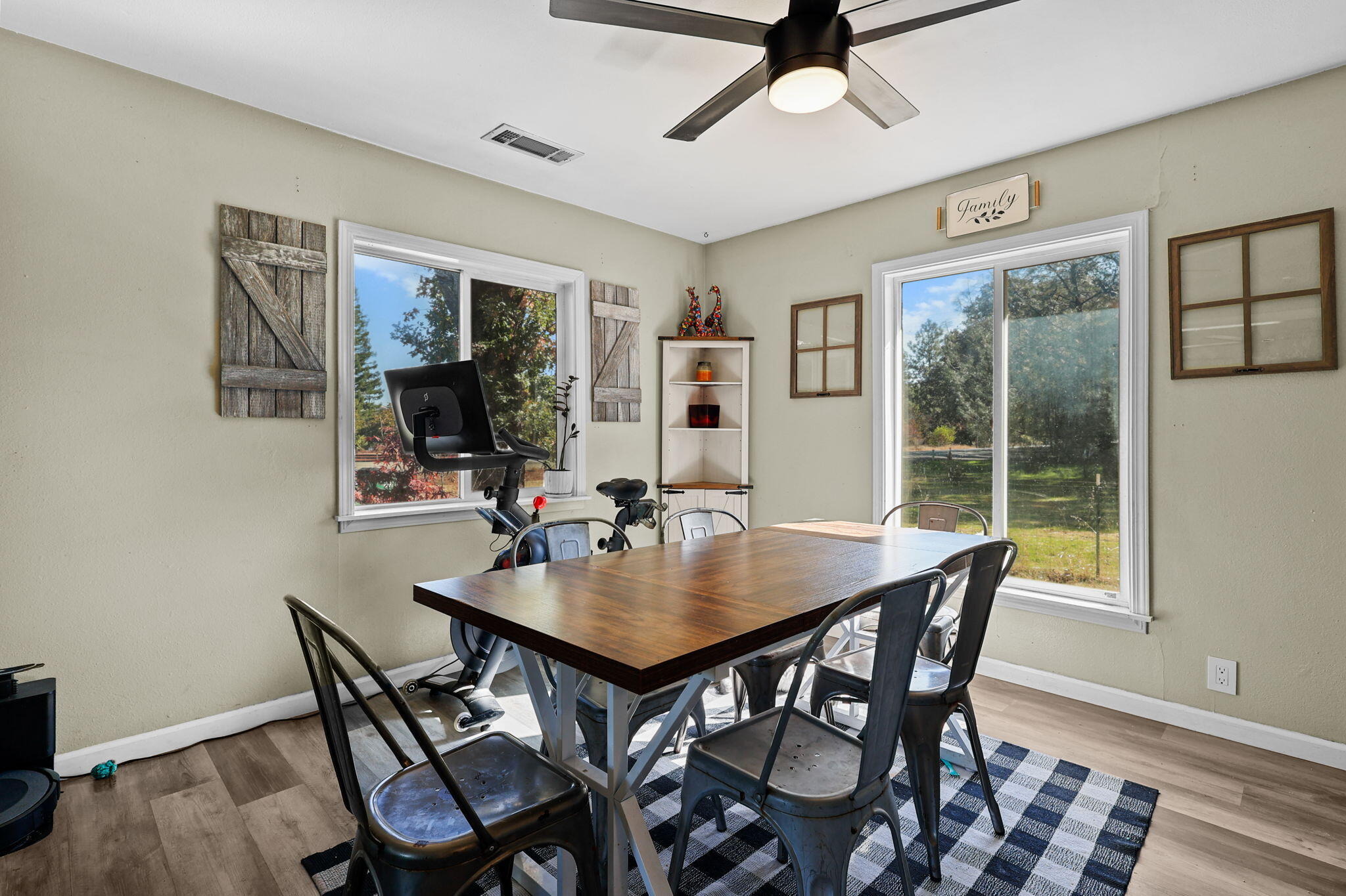 28093 Highway 44 Shingletown, CA 96088 - Photo 9 of 42 a view of a dining room with furniture window and wooden floor