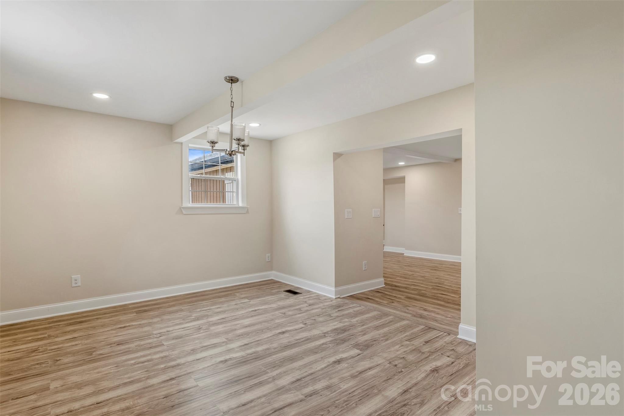2480 Artz Road Salisbury, NC 28146 - Photo 26 of 33 an empty room with wooden floor and windows