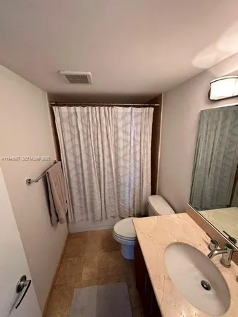 a bathroom with a sink and toilet