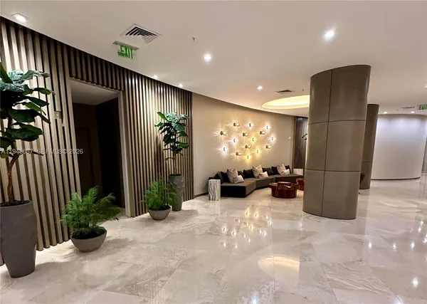 a room with lots of wooden furniture and a chandelier