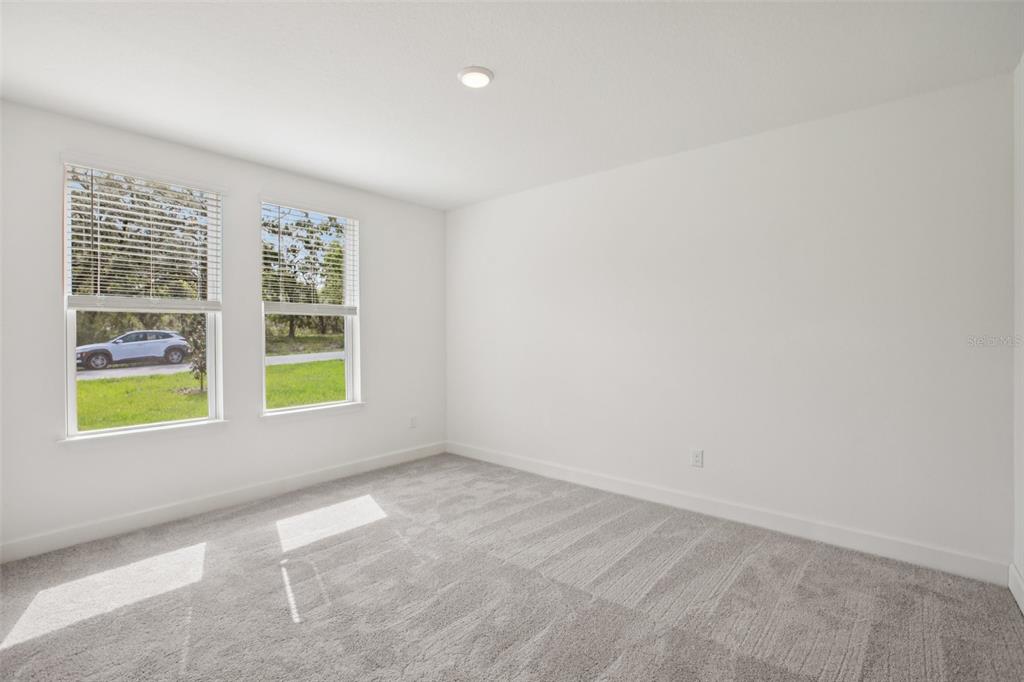 3033 Magellan Avenue Spring Hill, FL 34608 - Photo 24 of 42 an empty room with windows