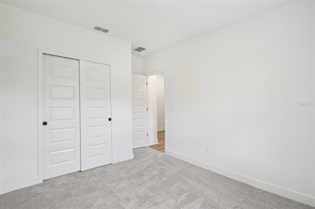 3033 Magellan Avenue Spring Hill, FL 34608 - Photo 28 of 42 an empty room with closet area