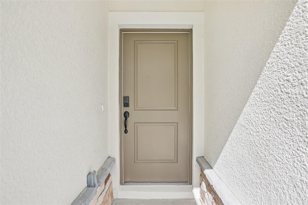 3033 Magellan Avenue Spring Hill, FL 34608 - Photo 4 of 42 a view of front door with hallway