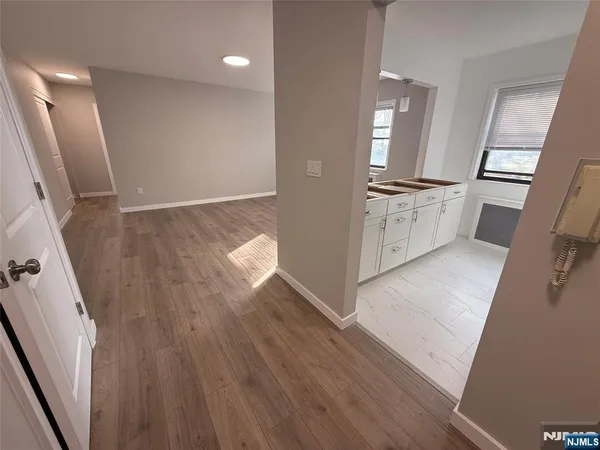 wooden floor in an empty room with a stove